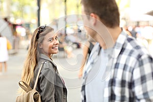 Strangers girl and guy flirting on the street photo