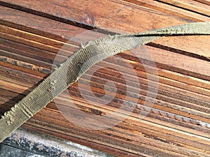 Strap on pile of ply wood photo