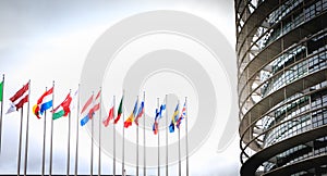 Set of european flags in front of the european parliament