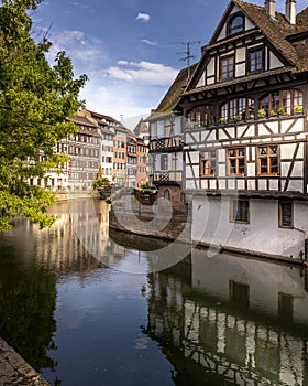 Traditional half-timbered houses on the picturesque canals of La Petite France in the medieval town of Strasbourg