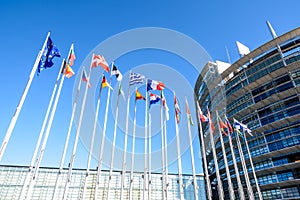 Two rows of flags in front of the European Parliament building in Strasbourg, France