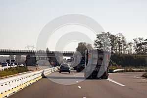 Railway crosses car track on bridge