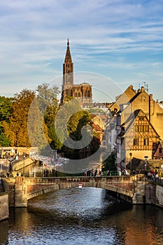 Strasbourg iconic cityscape. Petite France historic medieval district with Ill river and the cathedral in the background.