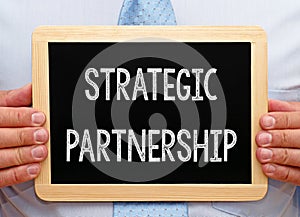 Strategic Partnership - Businessman with chalkboard photo