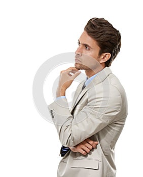 Strategizing...Studio shot of a handsome young businessman thinking isolated on white.