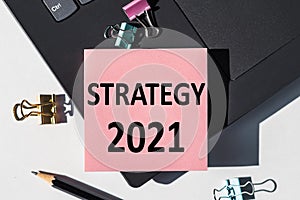 Strategy 2021 - text label on a computer keyboard. A promising approach to achieving sustainable competitive advantage, finding