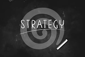 Strategy  written with chalk on blackboard icon logo design vector illustration