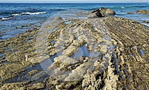 Stratified rocky shoreline at Crystal Cove State Park, Southern California.