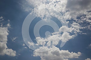 Stratocumulus clouds with a clear blue sky background in the midday.