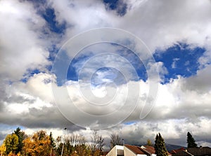 Stratocumulus clouds after rain over autumn landscape