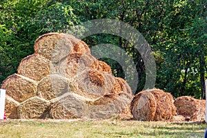 Straw bales on farmland. Bale of straw. Straw bales. Selective focus. Straw bales stacked on the pile.