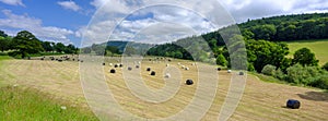 Straw bales in a field on the banks of the river Usk at Llandetty near Tay-y-bont, Wales