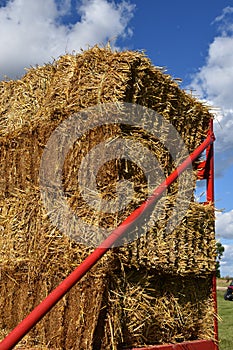 Straw bales have been loaded on a hay rack.