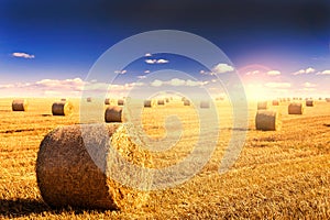 Straw bales and sunset