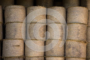 Straw bales under a roof on a farm