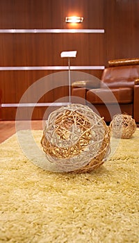 Straw ball on the fur carpet