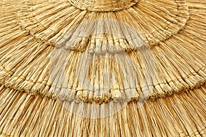 Straw beach umbrella close-up