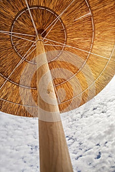 Straw beach umbrella close up image