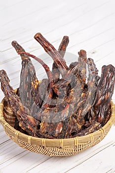 Straw bowl full of dried oxtails.