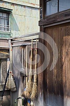 Straw Brooms on Fence at Shitaya Jinja Shinto Shrine