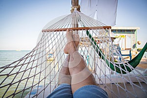Straw hammock in balcony at tropical beach for relaxation
