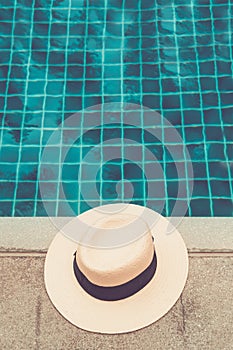 Straw hat at the pool edge