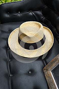 Straw Hat on Seat of Old Car