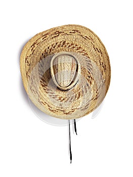 straw hat top view isolated on white background. Close up of wide brimmed straw hat from the French West Indies. Culture, fashion