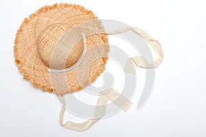Straw hat on a white background. Traditional object used in the June festivities in Brazil. Known as chapeu de palha