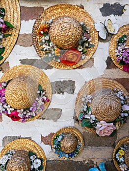 Straw hats with flowers decorating brick house walls in Ikseondong Hanok village in Seoul