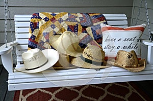 Straw hats on a swing