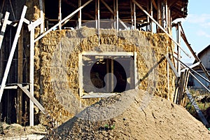 Straw house with a roof