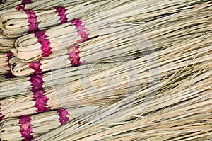 Straw with magenta bindings in African market