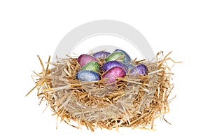 Straw nest with chocolate Easter eggs