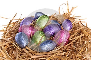 Straw nest with chocolate Easter eggs