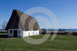 Straw roofed cottage house photo