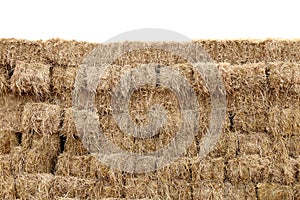 Straw, straw block cube wall, row pile straw dry, hay isolated white background, straw for decoration event country cowboy style