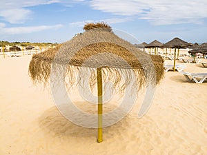 Straw sunshade on a beach in Portugal.