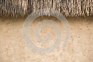 straw thatched roof and soil wall background