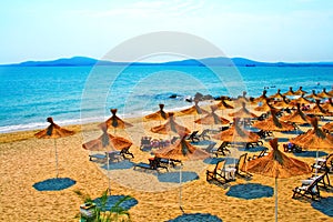 Straw umbrellas on peaceful beach in Bulgaria