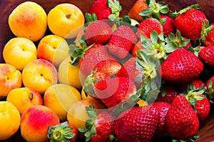 Strawberries and apricots photo