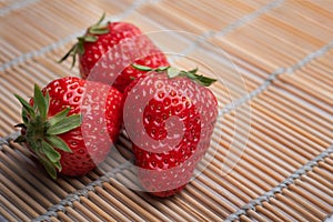 Strawberries on bamboo mats