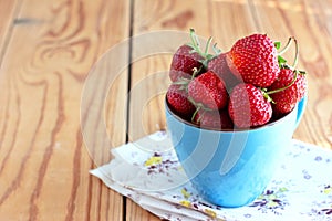 Strawberries in a blue cup