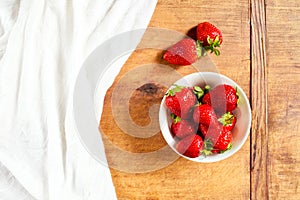 Strawberries in a bowl with copy space