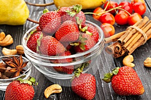 Strawberries bowl on wood
