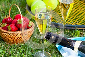 Strawberries, champagne and tennis balls photo