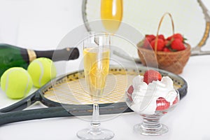 Strawberries and champagne with tennis equipment on Wimbledon tournament photo