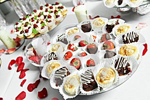 Strawberries with chocolate at catering party