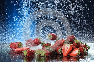 Strawberries closeup under the water drops in a dark blue background. Healthy lifestyle. Multivitamin cocktail. Summer diet. Set o