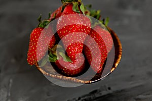 Strawberries in a Cup on a grey concrete background